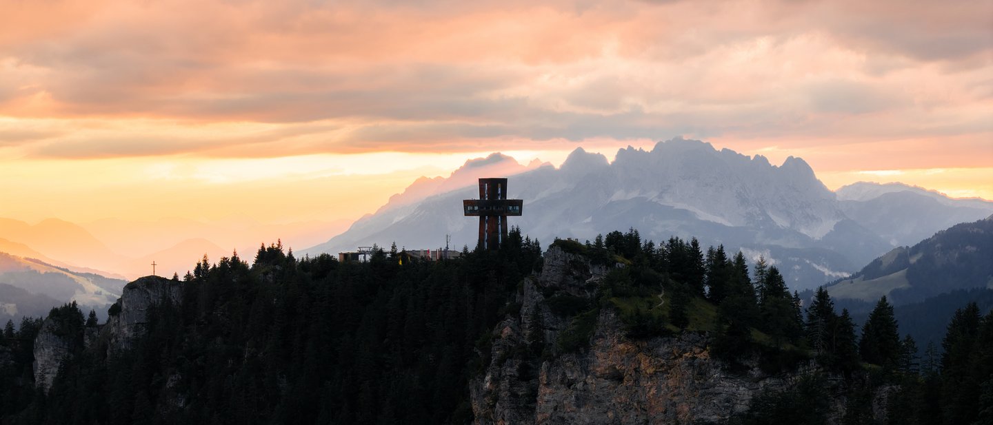 St. James' Cross on the Buchensteinwand in Fieberbrunn at sunset St. James' Cross on the Buchensteinwand in Fieberbrunn at sunset