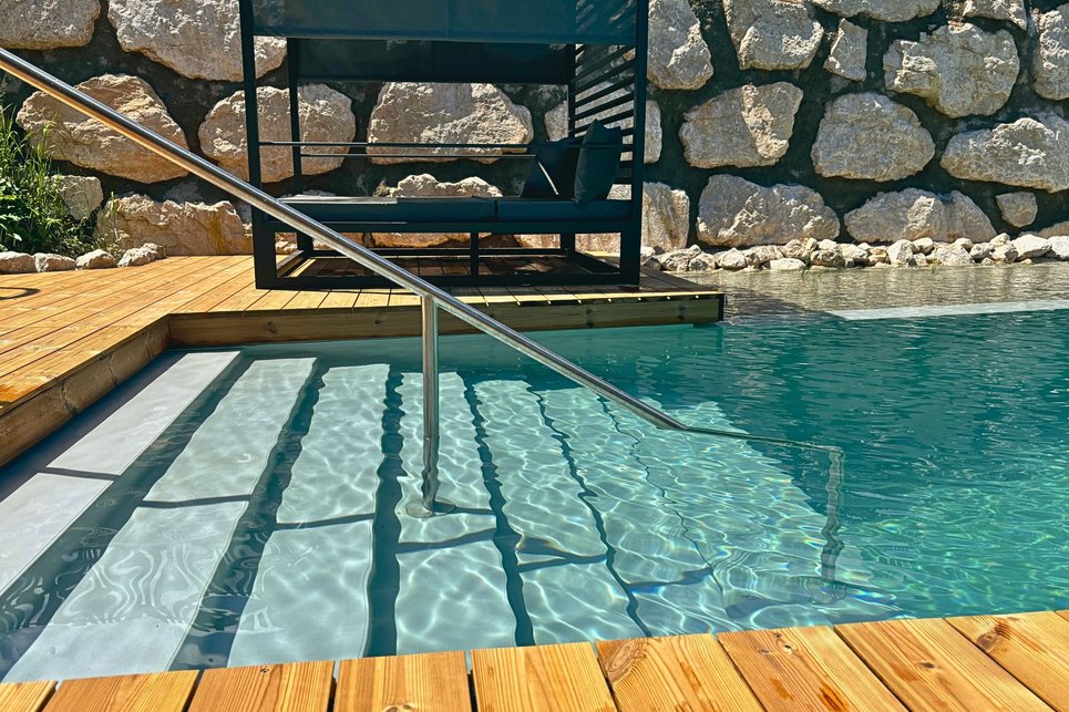 crystal-clear swimming pond with access crystal-clear swimming pond with access