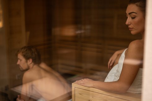 Couple sitting in sauna Couple sitting in sauna
