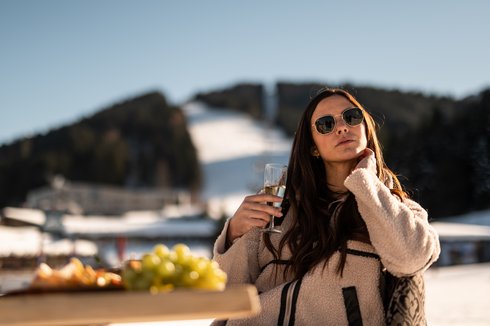 Woman sitting on the UPSIDEDOWN terrace in winter Woman sitting on the UPSIDEDOWN terrace in winter