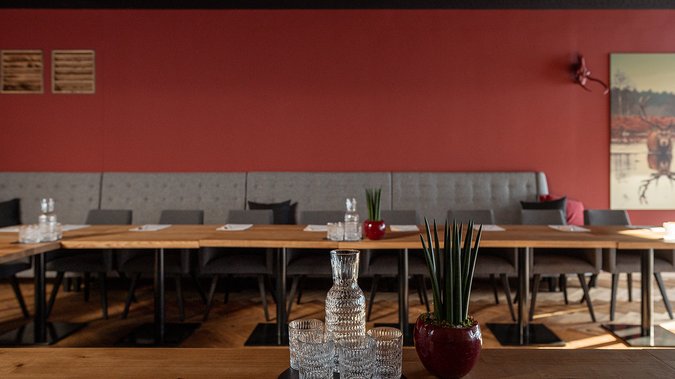 Red Saloon conference room with water carafes and glasses Red Saloon conference room with water carafes and glasses