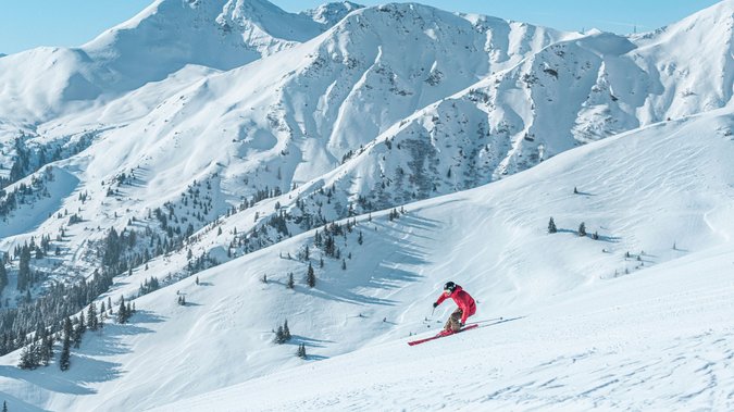 Man skiing in the Skicircus Saalbach Hinterglemm Leogang Fieberbrunn Man skiing in the Skicircus Saalbach Hinterglemm Leogang Fieberbrunn